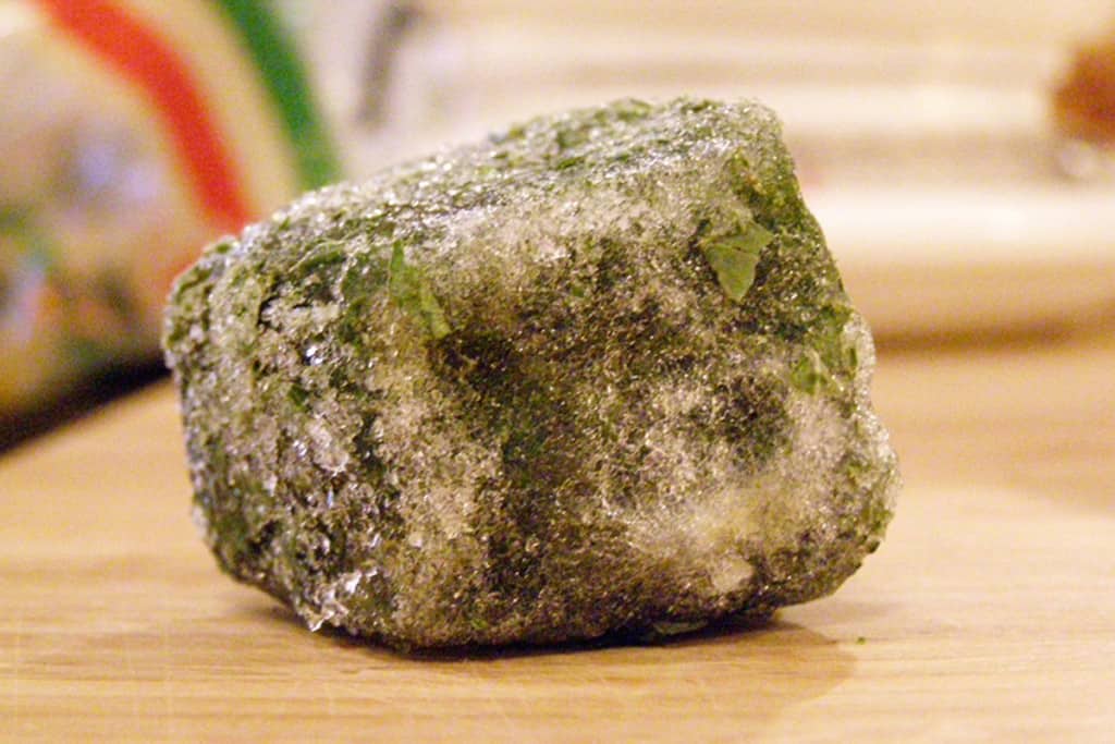 A cube of frozen basil.