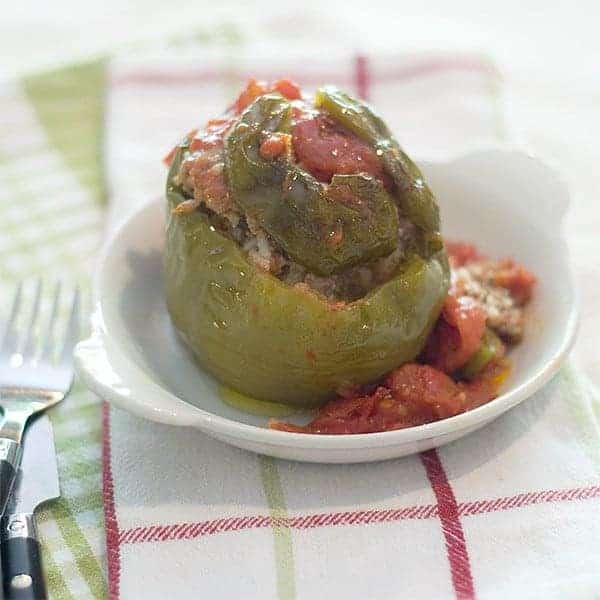 Good old Stuffed Bell Peppers - a classic stuffed with a beef and rice mixture topped with tomato sauce. https://www.lanascooking.com/stuffed-bell-peppers