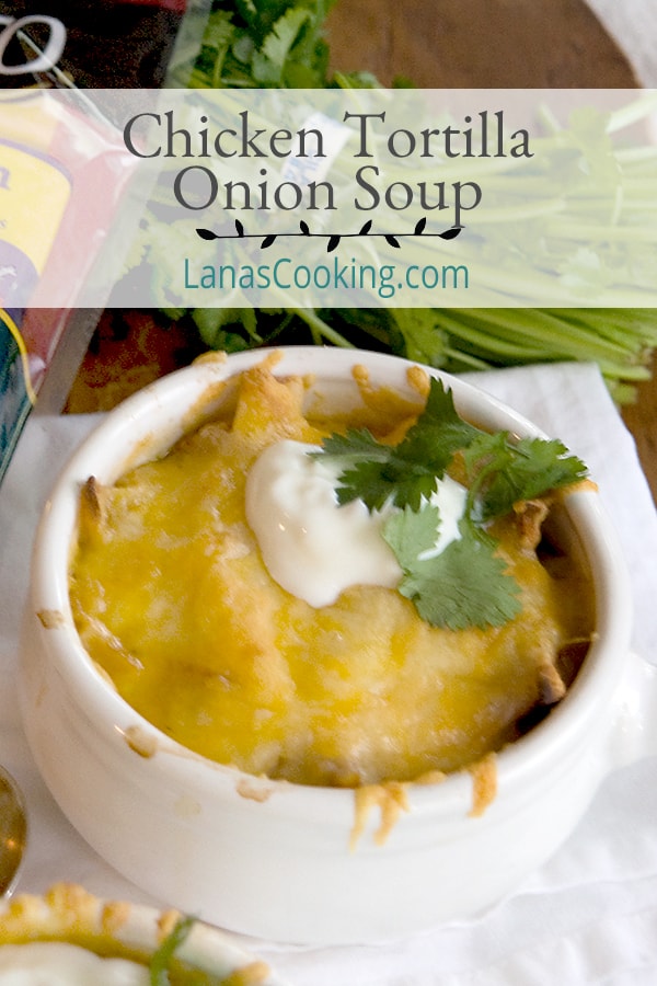 Chicken Tortilla Onion Soup - My Mexican riff on onion soup - with tortilla strips, chicken, onions, and poblano peppers - topped with a Mexican cheese blend. https://www.lanascooking.com/chicken-tortilla-onion-soup/