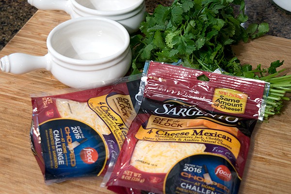 Onion soup bowls and shredded cheese.