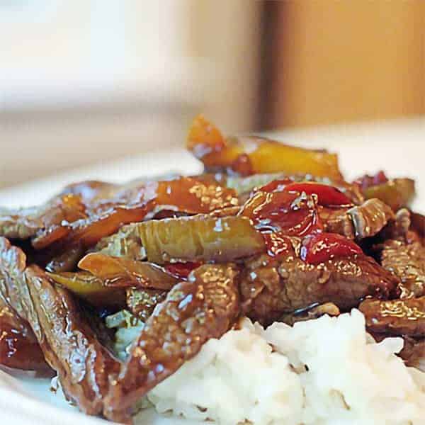 Sesame Beef Stir-Fry - a beef stir-fry with mixed vegetables seasoned with sesame oil. Serve over rice for an easy weeknight dinner. https://www.lanascooking.com/sesame-beef-stir-fry/