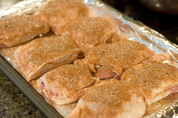 Chicken thighs sprinkled with spice mixture