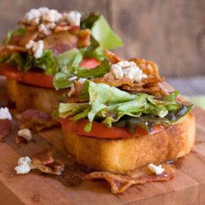 Garlic BLT Stacks - garlic bread topped with fresh tomato, bacon, lettuce, feta, and balsamic vinegar. https://www.lanascooking.com/garlic-blt-stacks