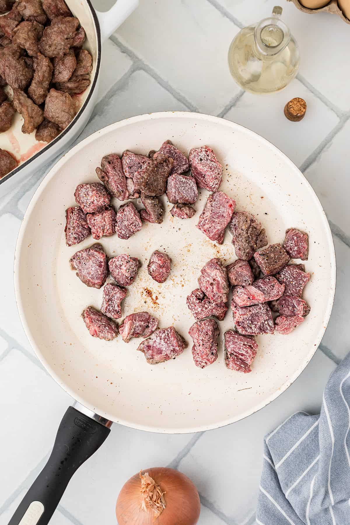 Beef browning in a skillet.