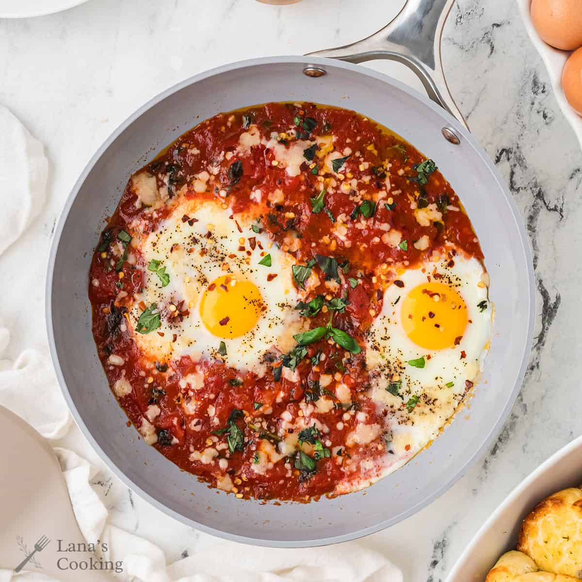 Finished eggs in purgatory in a skillet.