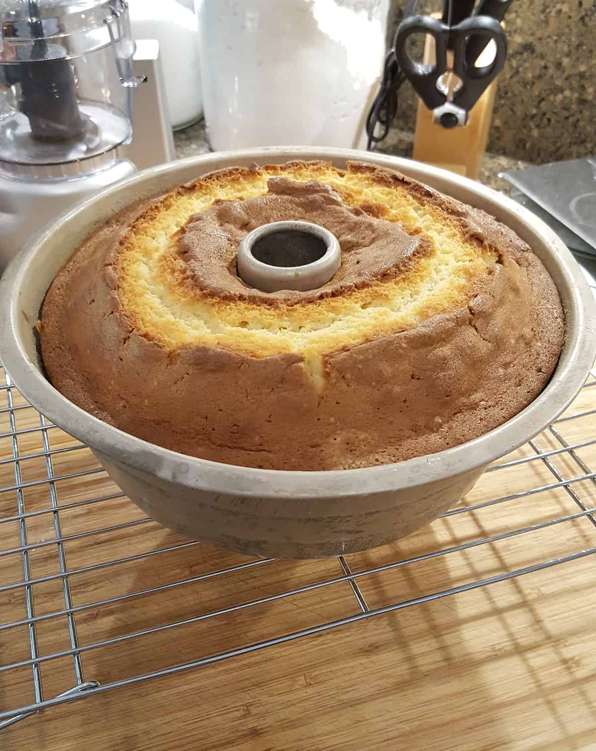 Cake cooling in pan on a rack.