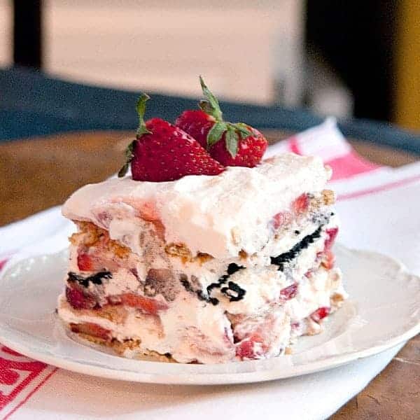 This fresh strawberry icebox cake is a no-bake treat featuring layers of graham crackers, chocolate wafers, strawberries and whipped cream. https://www.lanascooking.com/strawberry-icebox-cake/