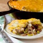 Classic Shepherd's Pie, or Cottage Pie, with ground beef and vegetables topped with creamy mashed potatoes and cheese. https://www.lanascooking.com/shepherds-pie/