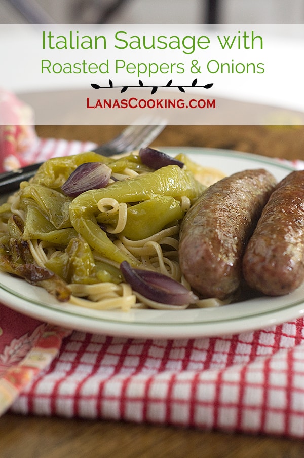 Italian Sausage with Roasted Peppers and Onions on a dinner plate.easy sheet pan dinner that cooks on one pan in the oven. Add a salad and dinner is ready. https://www.lanascooking.com/italian-sausage-roasted-peppers-onions/
