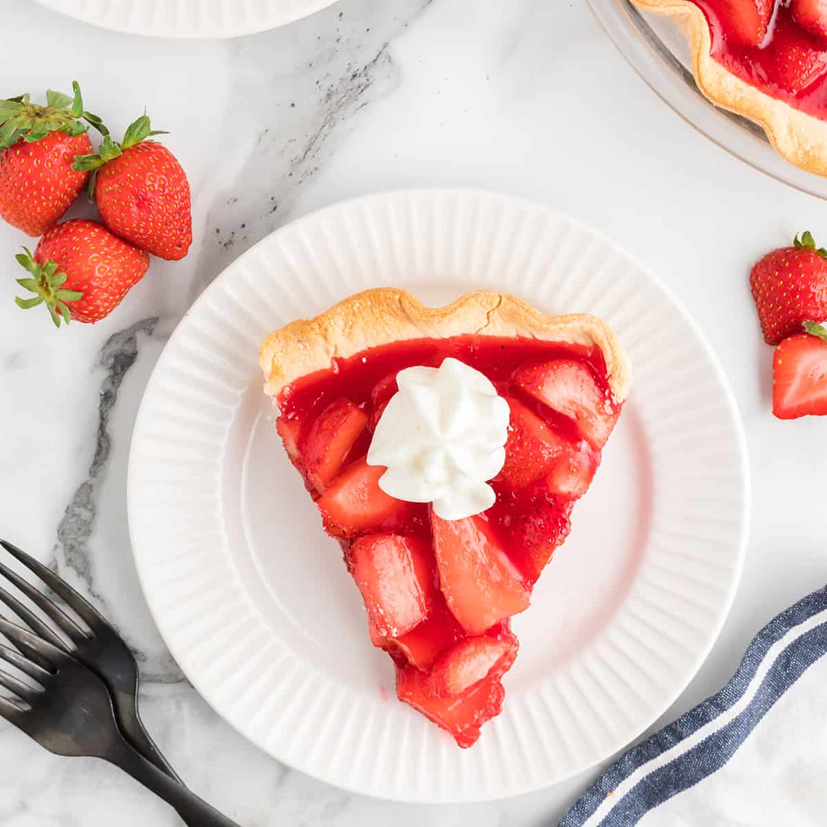 A serving of pie on a white plate.