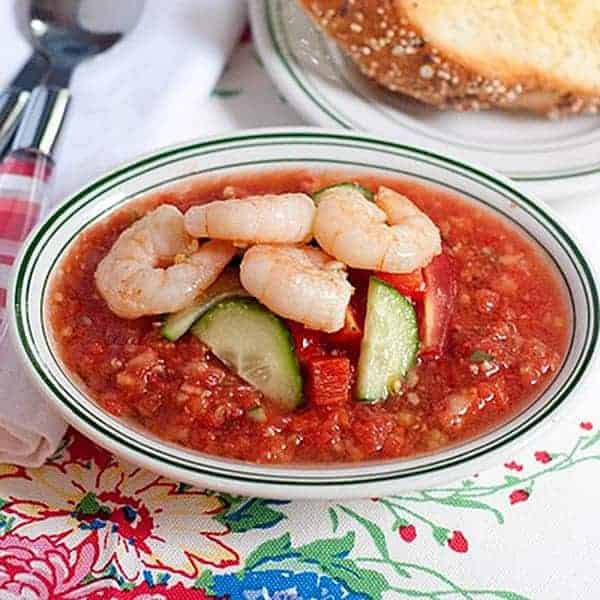 Gazpacho and Garlic Shrimp with Cheese Toasts - Fresh, summery gazpacho topped with buttery, garlic shrimp and served with cheese toasts. https://www.lanascooking.com/gazpacho