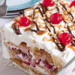 Banana Split Icebox Cake - an old fashioned dessert with layers of whipped cream, banana, strawberries, and pineapple. https://www.lanascooking.com/banana-split-icebox-cake