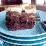 Chocolate Marshmallow Poke Cake - chocolate cake, chocolate pudding, and toasted marshmallows in a fun, retro recipe that the whole family will enjoy! https://www.lanascooking.com/chocolate-marshmallow-poke-cake/