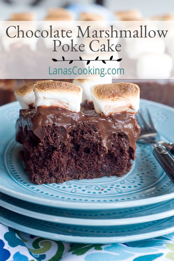 A serving of chocolate marshmallow poke cake on a blue plate.