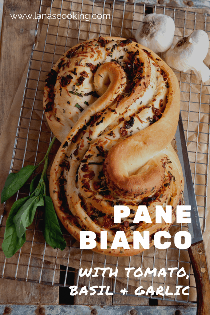Pane Bianco Filled with Tomato, Basil, and Garlic. A soft white loaf filled with sundried tomatoes, fresh basil, cheese, and garlic. https://www.lanascooking.com/pane-bianco-filled-with-tomato-basil-and-garlic-twelveloaves