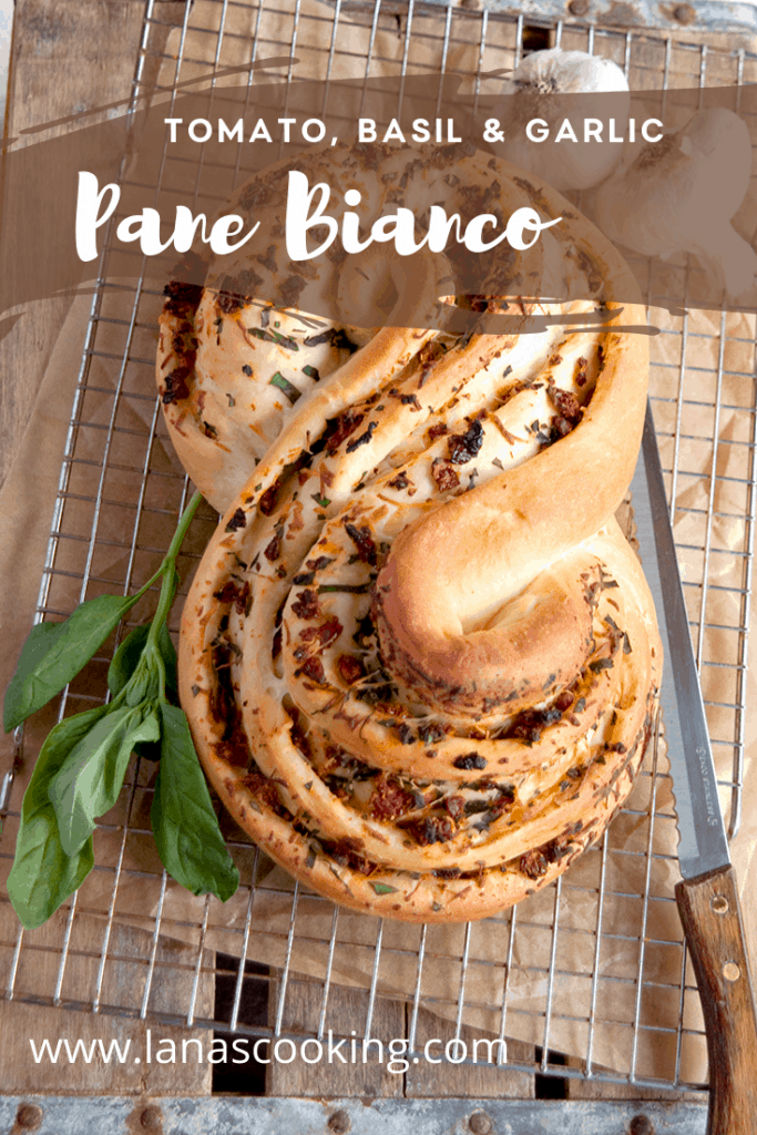 Pane Bianco Filled with Tomato, Basil, and Garlic. A soft white loaf filled with sundried tomatoes, fresh basil, cheese, and garlic. https://www.lanascooking.com/pane-bianco-filled-with-tomato-basil-and-garlic-twelveloaves