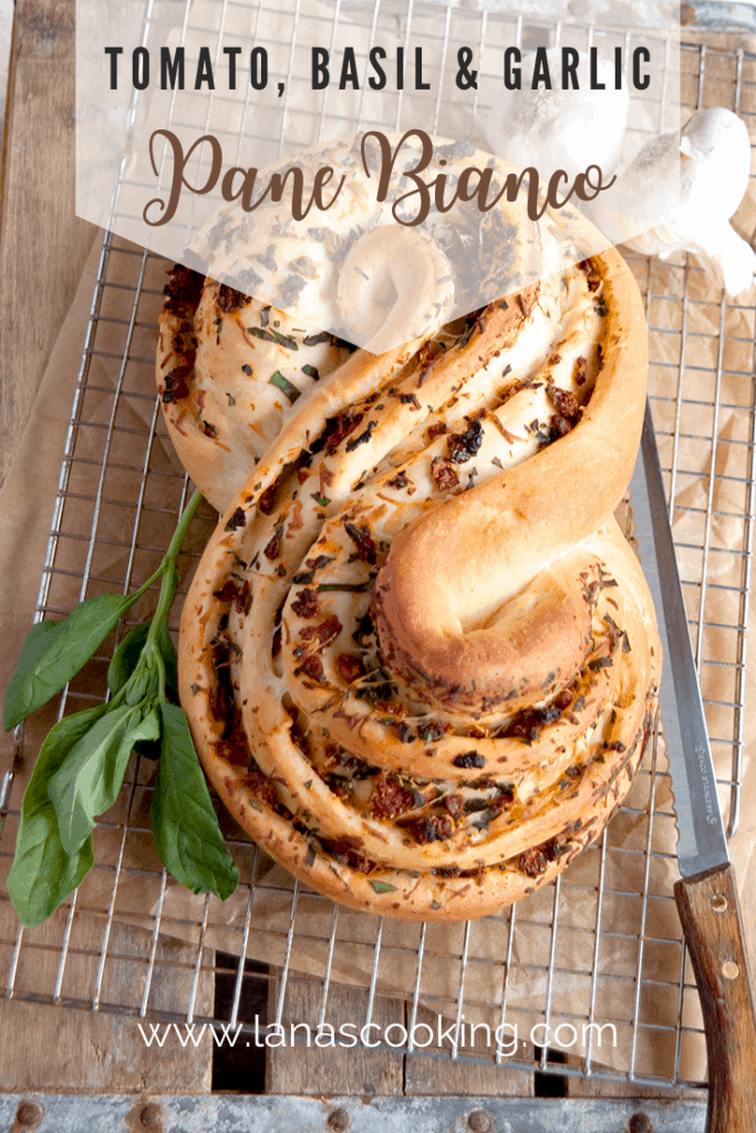 Pane Bianco with Tomato, Basil, and Garlic. A soft white loaf filled with sundried tomatoes, fresh basil, cheese, and garlic. https://www.lanascooking.com/pane-bianco-filled-with-tomato-basil-and-garlic-twelveloaves