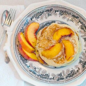 Fresh ripe peaches and pecans make these Peach-Pecan Pancakes a special breakfast or brunch treat! https://www.lanascooking.com/peach-pecan-pancakes/