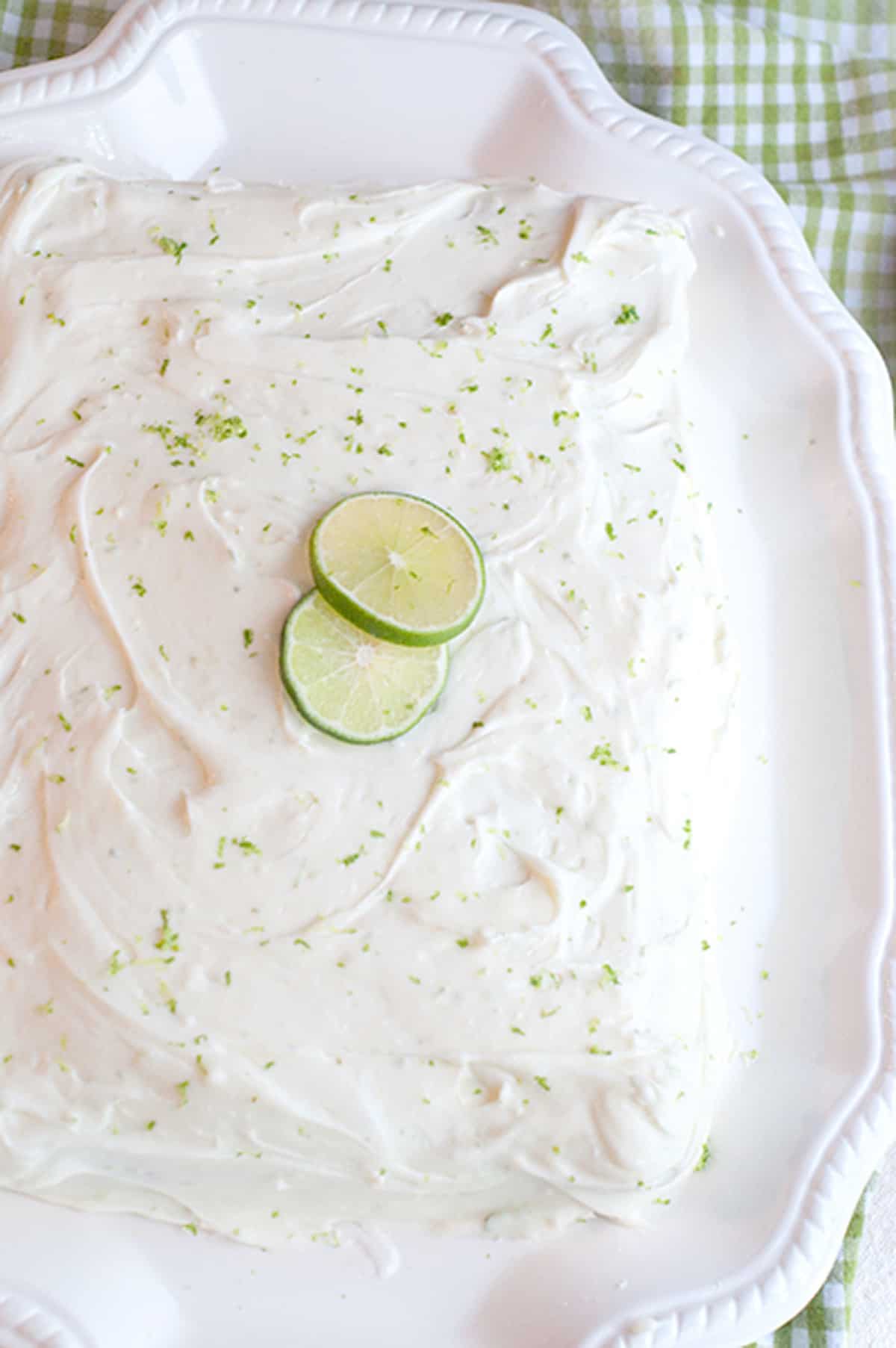 Completed cake on a white platter.