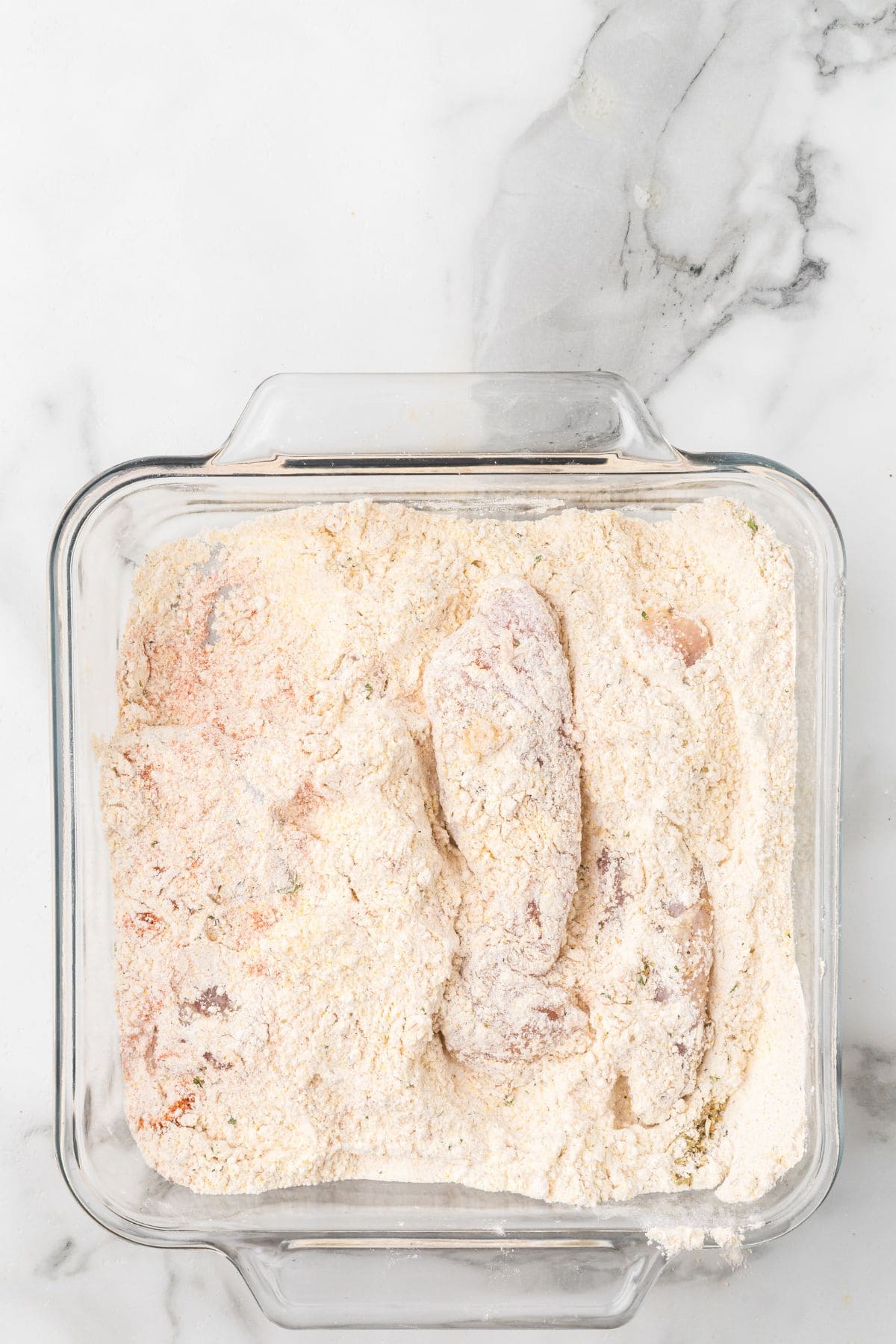 Chicken strips coated with dry mixture.