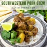 A plate of Southwestern pork stew with rice, potatoes, cilantro, and a lime wedge, served next to tortillas.