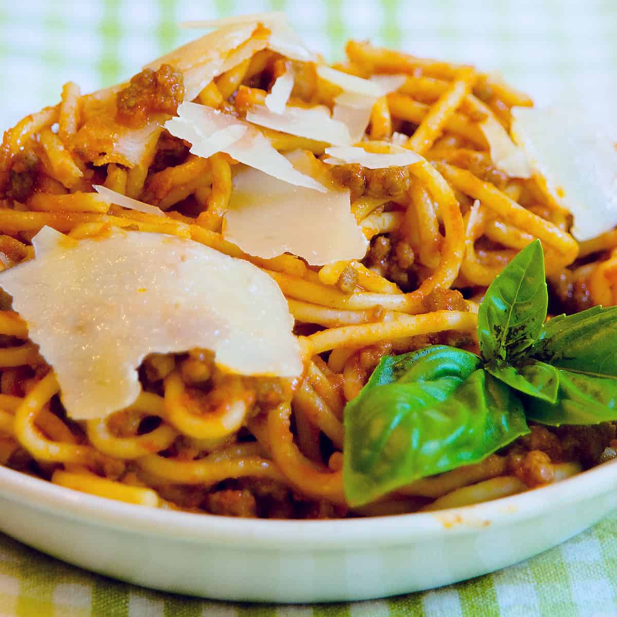 Finished bolognese sauce with spaghetti in a serving bowl.