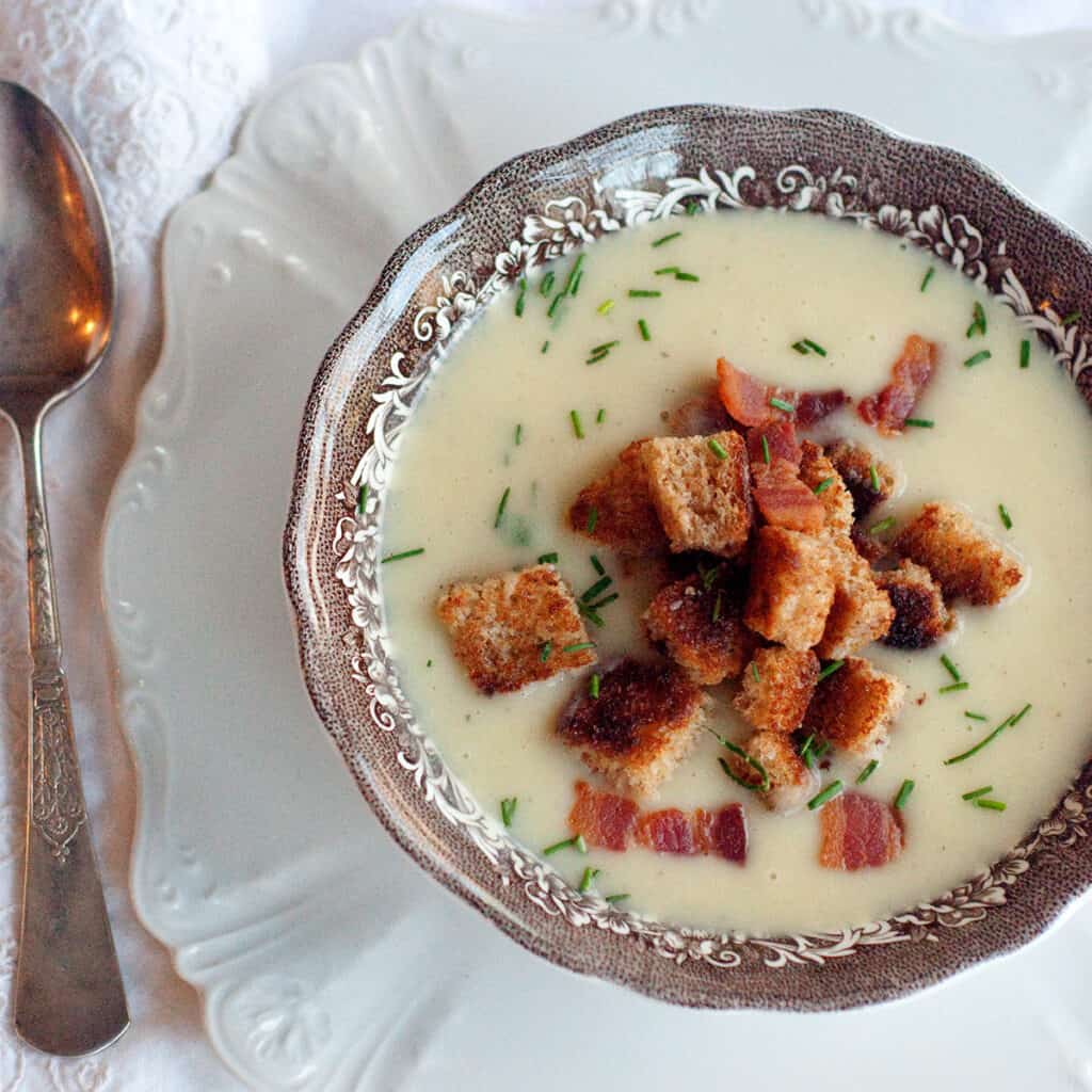 Leek and Potato soup with croutons and bacon garnish.