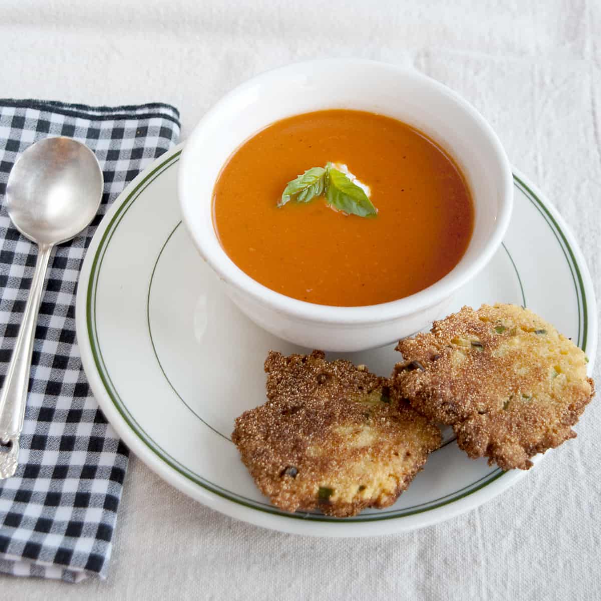 Tomato and Roasted Garlic Soup is a classic tomato soup recipe with the addition of roasted garlic. Perfect for dipping with a grilled cheese sandwich. https://www.lanascooking.com/tomato-roasted-garlic-soup