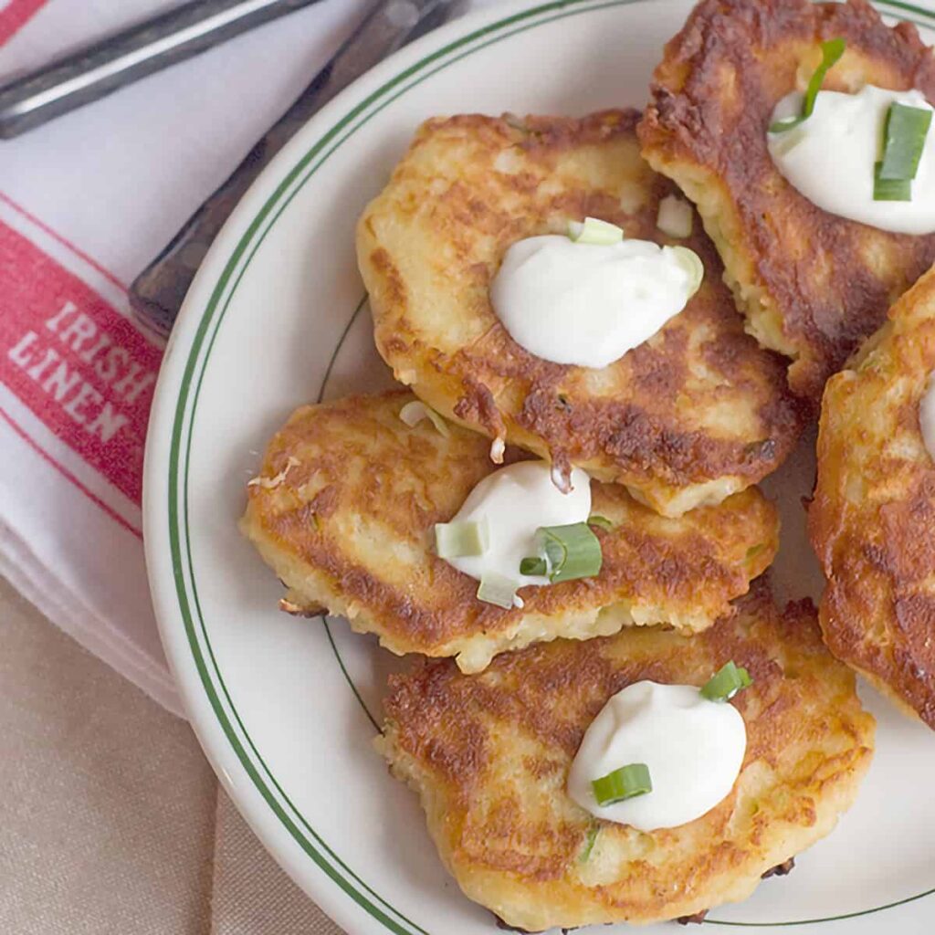 Boxty is a traditional Irish potato pancake. Serve them up hot with a dollop of sour cream and a sprinkle of green onions. https://www.lanascooking.com/boxty