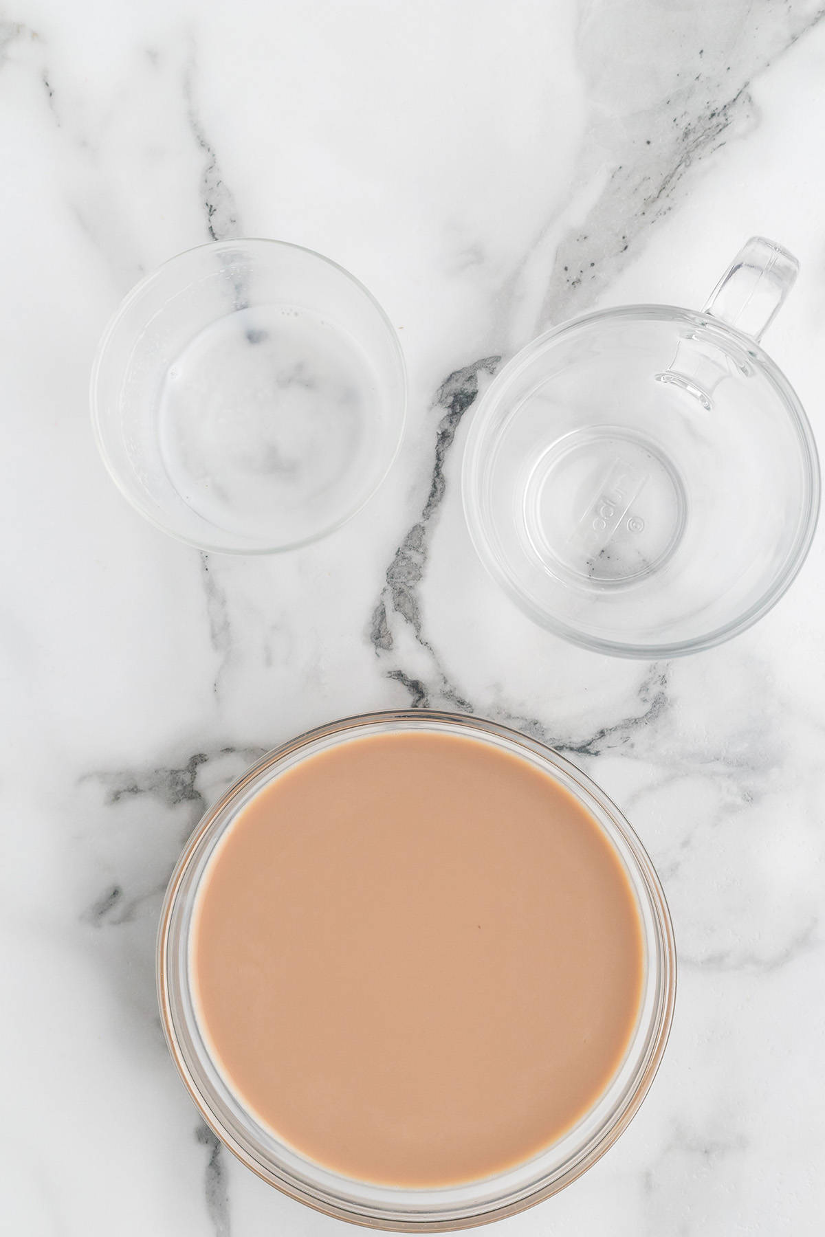 Warm milk added to the bowl.
