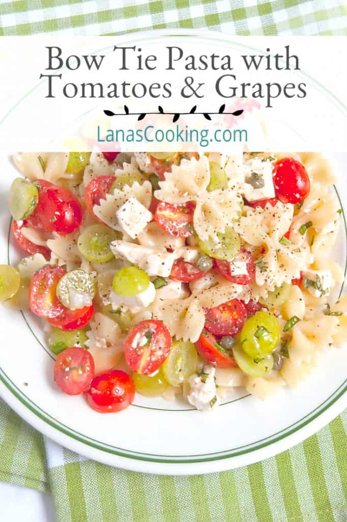 Bow Tie Pasta Salad with Tomatoes and Grapes - a surprising combination for a refreshing summery pasta salad. Great for a cookout or picnic! https://www.lanascooking.com/bow-tie-pasta-salad-with-tomatoes-and-grapes/