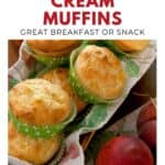 Peach muffins in green wrappers on a tray, with fresh peaches beside them. Text: Peaches and Cream Muffins.