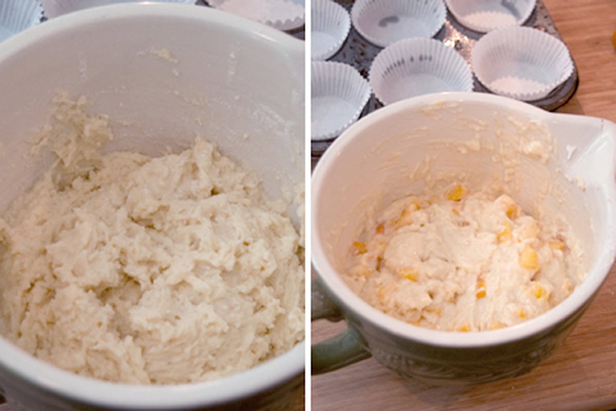Two bowls of muffin batter, one plain and one with corn, near a muffin tin lined with paper cups.