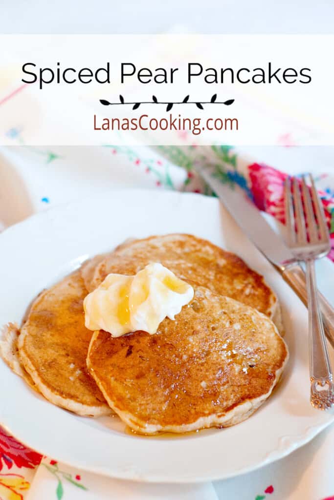Finished pancakes topped with yogurt and syrup on a white serving plate.