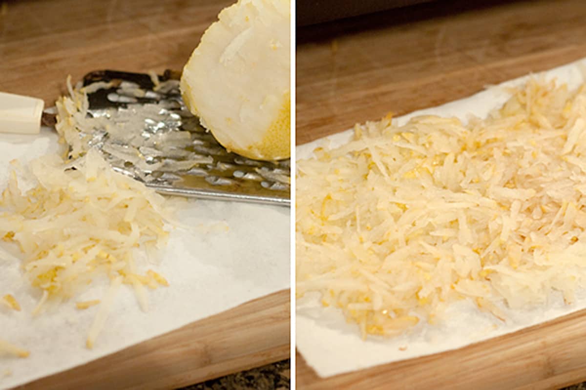 A fresh pear grated onto a paper towel.