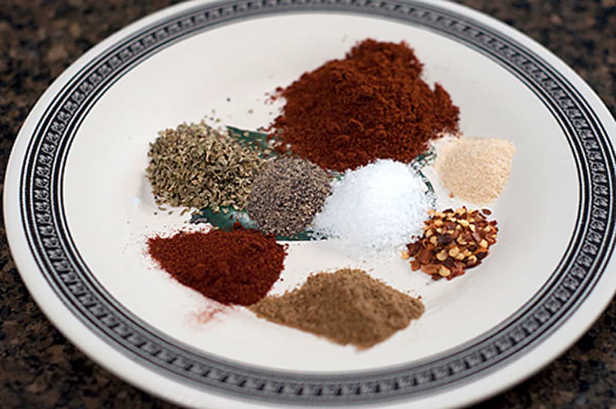 Spices used in the recipe portioned out on a small plate.