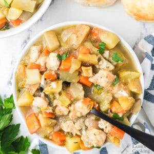 Chicken stew in a white bowl.