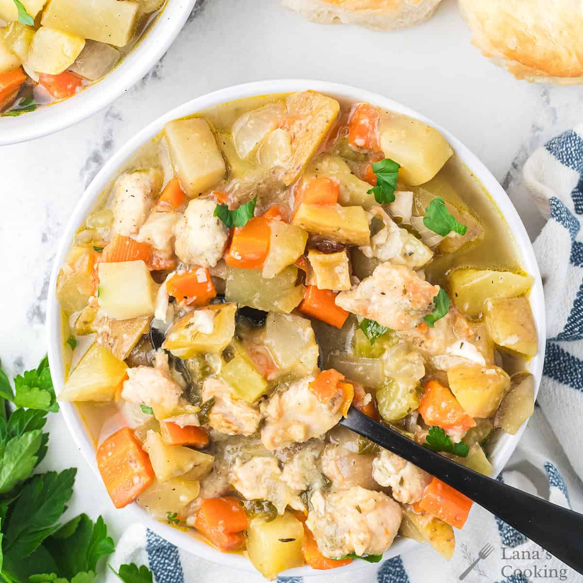 Chicken stew in a white bowl.