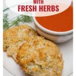 Two herb drop biscuits on a plate with a bowl of tomato soup; text promotes biscuits with fresh herbs.