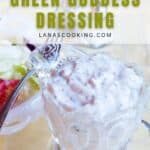 A glass container filled with creamy green goddess dressing sits on a table next to a plate of salad. Text reads: Old Fashioned Green Goddess Dressing lanascooking.com.