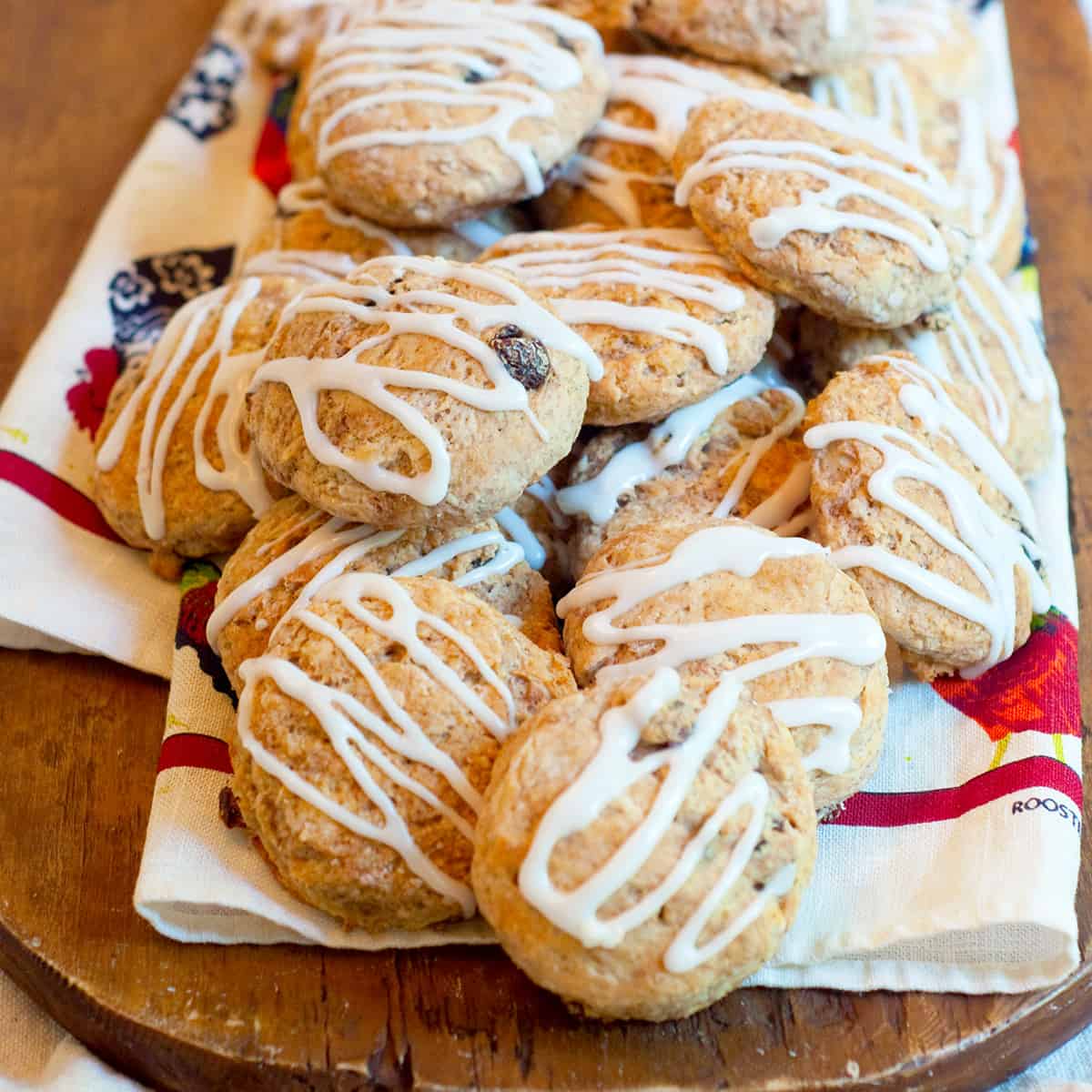 Cinnamon raisin biscuits on a wooden board.