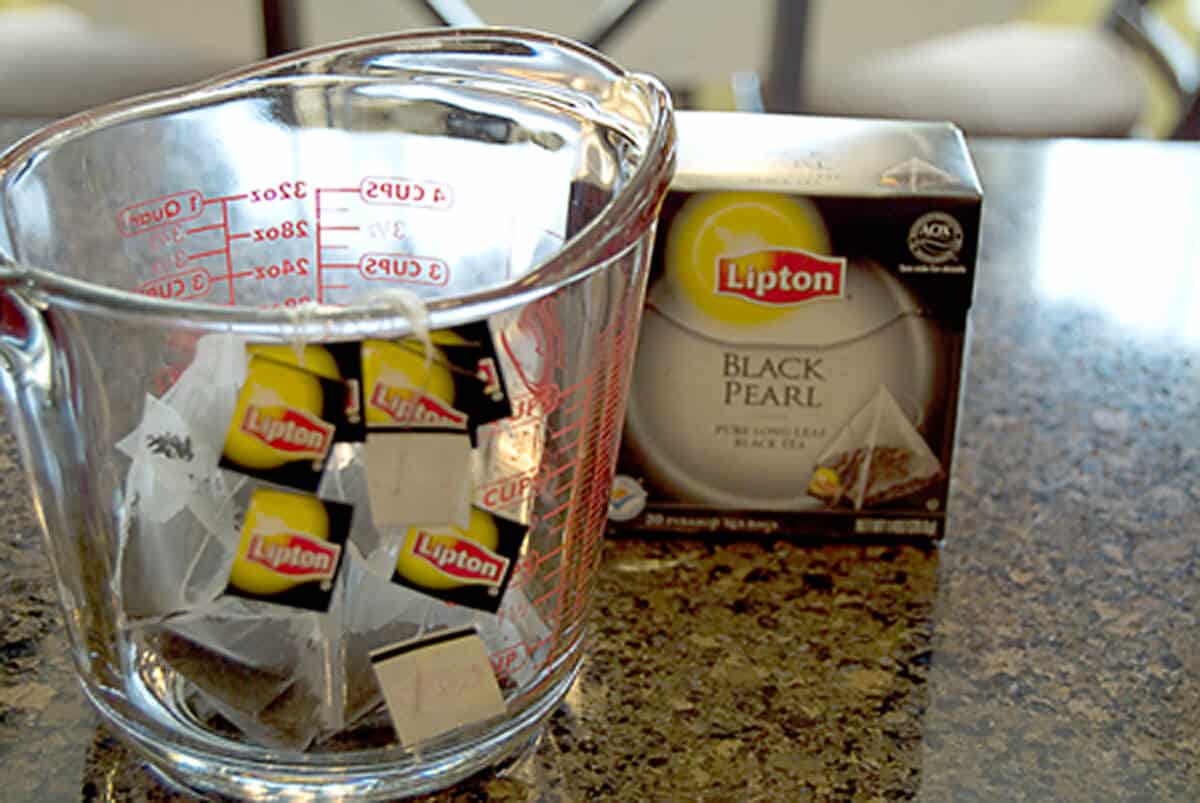 Tea bags in a measuring cup.