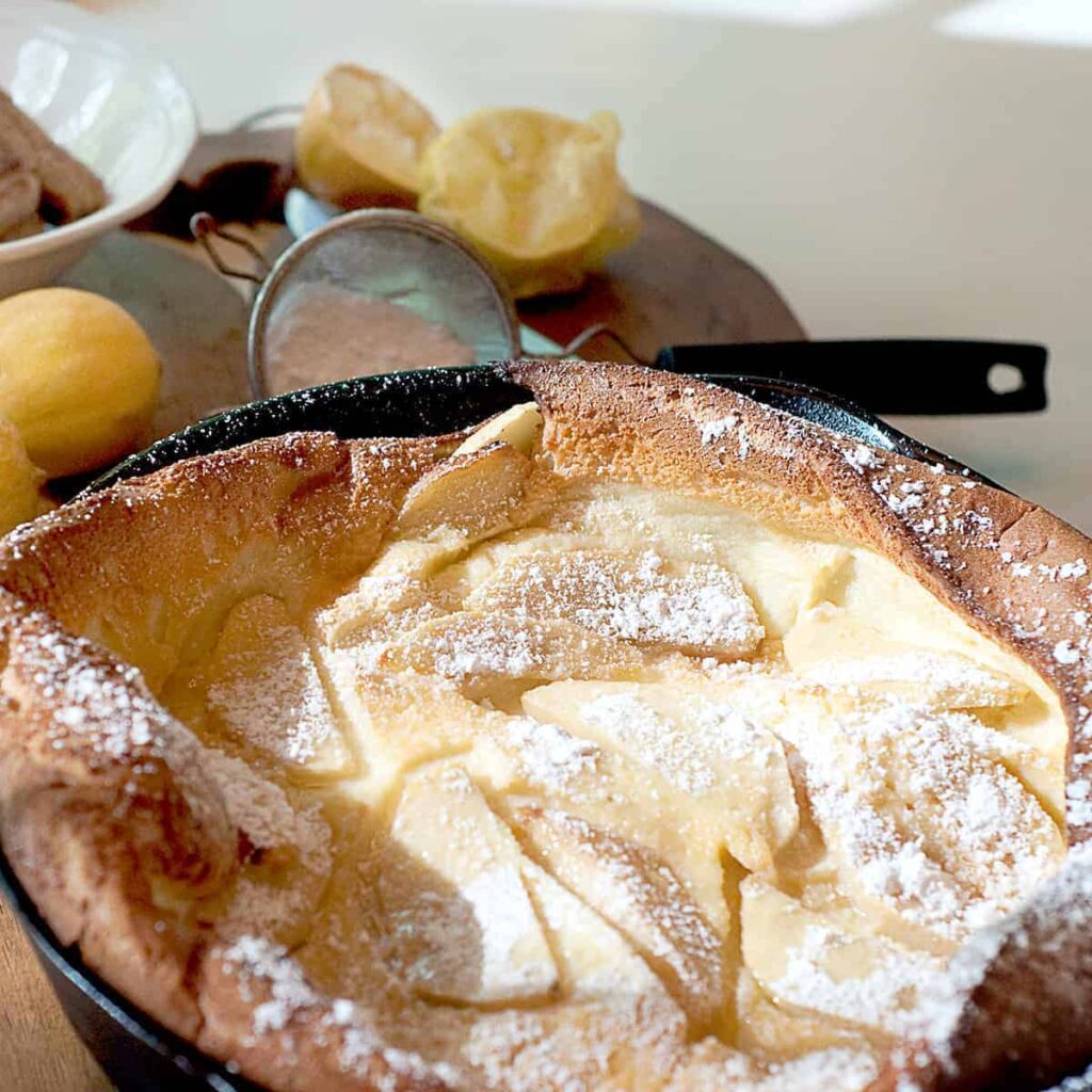 A light fluffy Dutch baby is just a big pancake cooked in the oven! Topped with lemon juice and powdered sugar, this breakfast treat is simply delicious. https://www.lanascooking.com/dutch-baby/