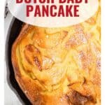 A golden Dutch baby pancake in a skillet, dusted with powdered sugar. Text reads “Dutch Baby Pancake.”.