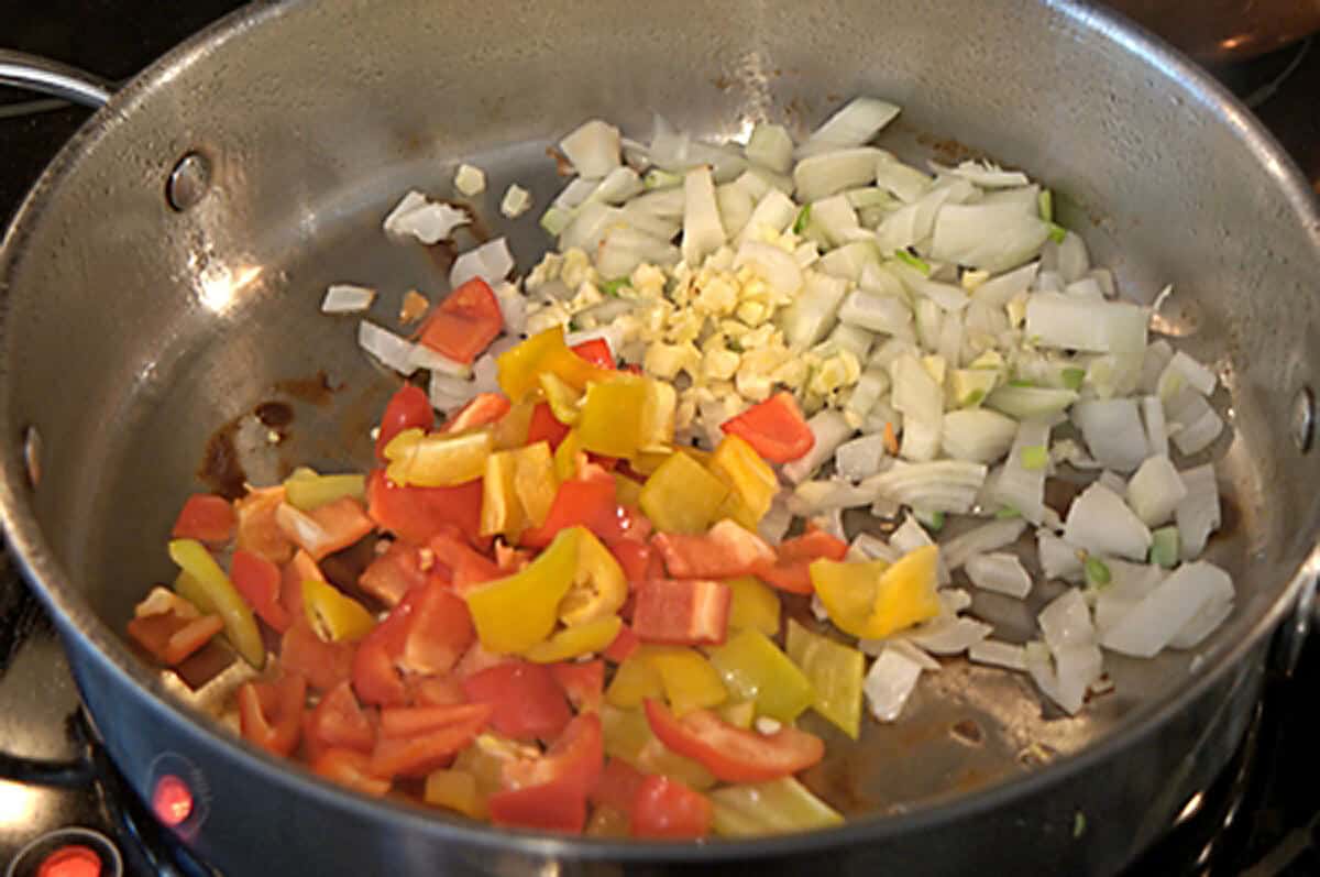 Onions and peppers browning in the skillet.