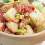 Bowl of lemon dill potato salad with chopped vegetables, labeled No Mayo! and website link.