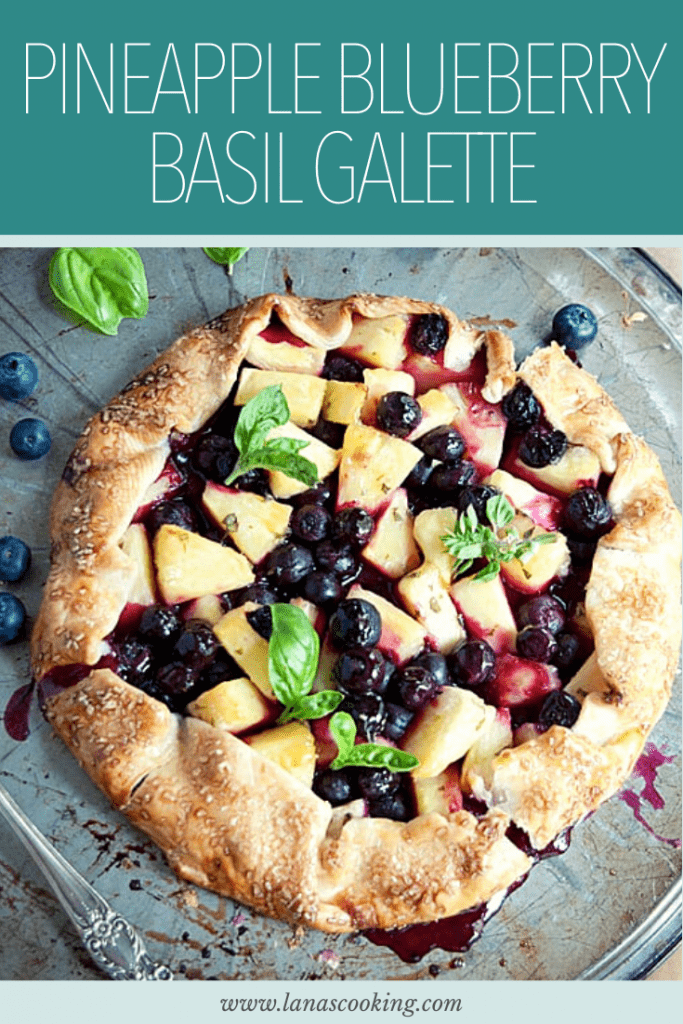 A freeform Pineapple Blueberry Basil Galette using purchased pie crust. A most unusual dessert full of fruity, herby flavors. https://www.lanascooking.com/pineapple-blueberry-basil-galette/