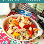 Summertime Pasta Salad - a cold pasta salad packed with fresh veggies and lightly dressed with a parmesan and garlic dressing. https://www.lanascooking.com/summertime-pasta-salad/