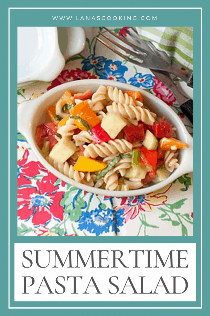 Summertime Pasta Salad - a cold pasta salad packed with fresh veggies and lightly dressed with a parmesan and garlic dressing. https://www.lanascooking.com/summertime-pasta-salad/