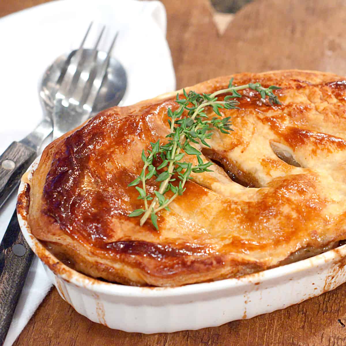 A rich, savory Beef and Stout pie with mushrooms and onions. Wonderfully comforting traditional Irish food. https://www.lanascooking.com/beef-and-stout-pie/